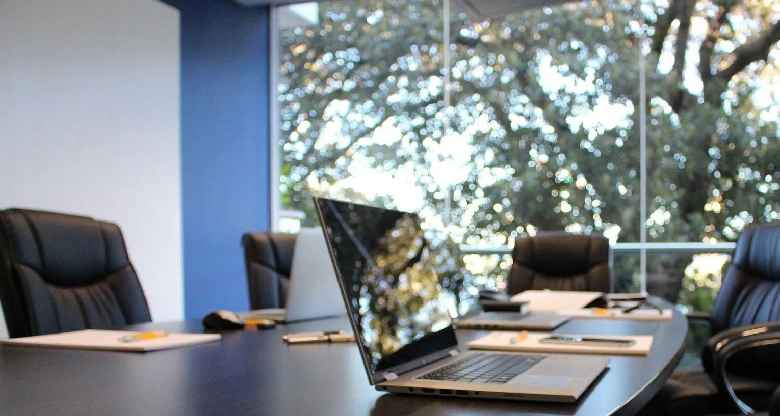 Laptop on a boardroom table
